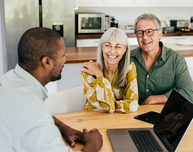 Mature couple meeting with financial advisor